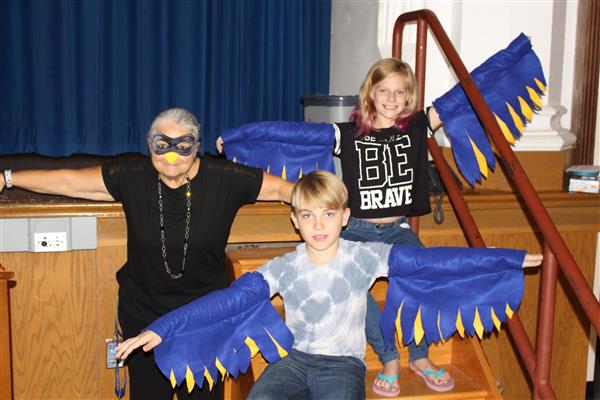 A crow and 2 eaglets teach students how to SOAR
